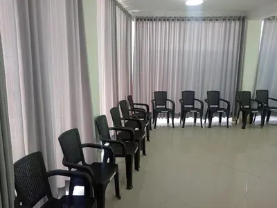 a row of chairs in a room with curtains at Chepe de mi Corazon in Abancay