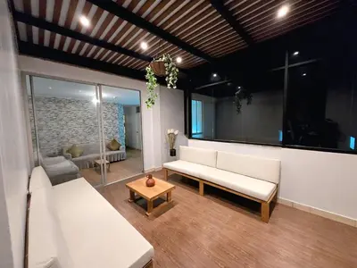 a living room with a white couch and a table at barranco apartament R&M in Lima