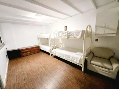 a room with two bunk beds and a chair at barranco apartament R&M in Lima