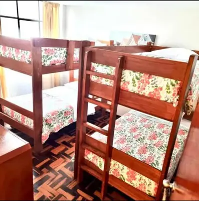 two bunk beds sitting in a room with at Duplex en San Borja in Lima