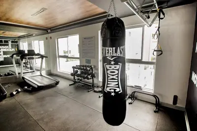 a gym with a snowboard hanging from a wall at View & Pool Barranco loft G15 in Lima