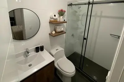 a bathroom with a shower and a toilet and a sink at Brand new apartment in Miraflores in Lima