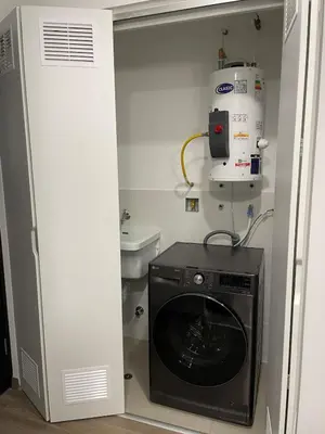 a laundry room with a washer and dryer in it at Brand new apartment in Miraflores in Lima