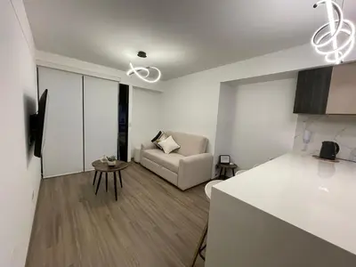 a living room with a couch and a table at Brand new apartment in Miraflores in Lima