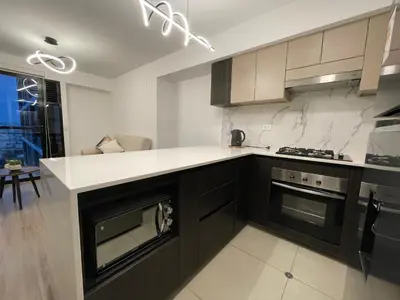 a kitchen with a counter and a stove top oven at Brand new apartment in Miraflores in Lima