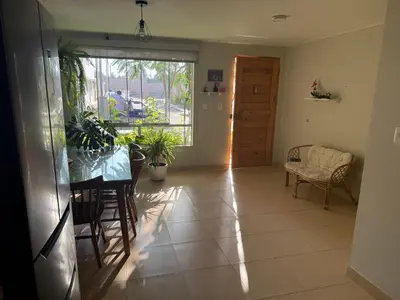 a living room with a table and chairs and a window at Ethan's House - Como en Casa