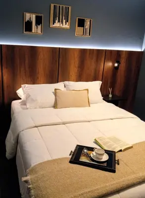a large white bed with a tray on top of it at Loft steps away from Larcomar for urban explorers in Lima