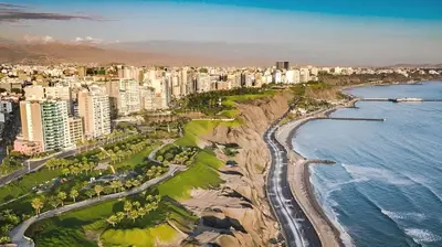 an aerial view of a city and the ocean at Loft steps away from Larcomar for urban explorers in Lima