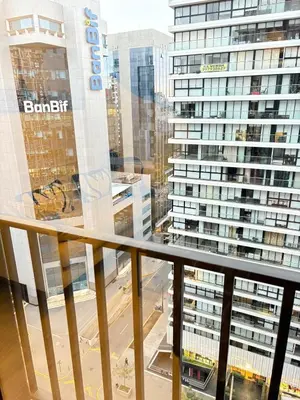 a balcony with a view of a large building at San Isidro Financial Flat Lima in Lima