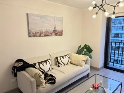 a living room with a couch and a window at San Isidro Financial Flat Lima in Lima