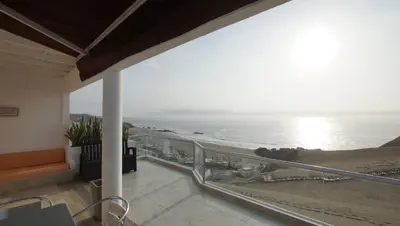 a balcony with a view of the ocean at Condominio Maradentro - Casas de playa en exclusivo balneareo de chepeconde in Los Leones