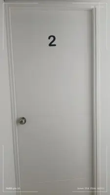 a shower door with the number two on it at HK5 Bed And Breakfast Apartment in Lima