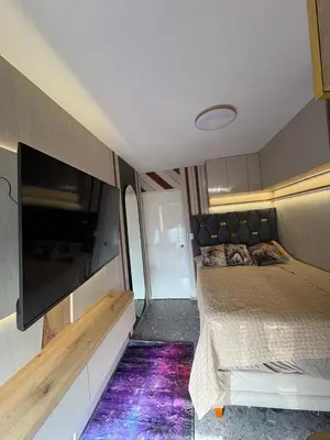 a room with a bed and a tv in it at Exclusivo new apartment in Lima in Lima