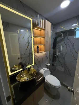 a bathroom with a sink and a toilet and a mirror at Exclusivo new apartment in Lima in Lima