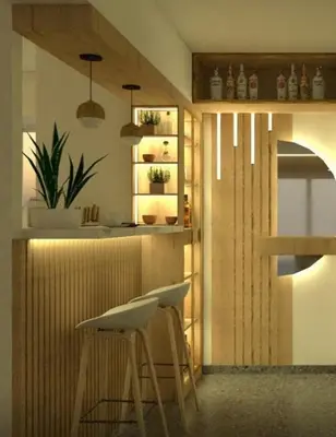 a kitchen with a bar with two stools in it at Exclusivo new apartment in Lima in Lima
