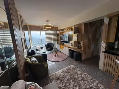 a living room with couches and a large window at Exclusivo new apartment in Lima in Lima