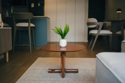 a table with a potted plant on it in a room at Estancia de lujo en Miraflores Entre Marriott y Pullman in Lima