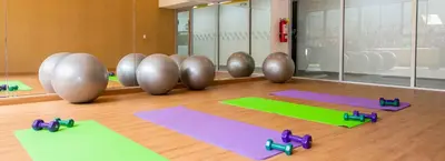 a yoga room with yoga mats on the floor at Depa moderno y ejecutivo en estreno, cerca de San Isidro y Miraflores - nómada in Lima