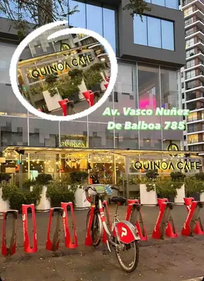 a bike parked next to red cones in front of a building at Cozy and Centric Flat with Great View and Parking in Lima