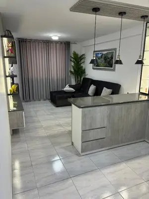 a living room with a couch and a table at Mini Departamento in Lima