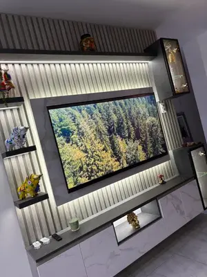 a large flat screen tv on a wall in a room at Mini Departamento in Lima