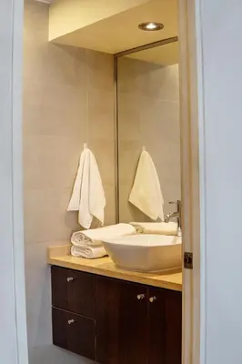 a bathroom with a sink and a mirror at Departamento Athelier in Lima