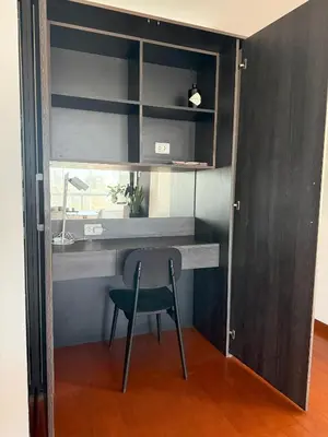 a desk with a chair in a room at Departamento Ricardo Palma in Lima