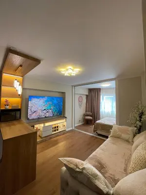 a living room with a large flat screen tv at Mini Apartment Ares 2 in Lima