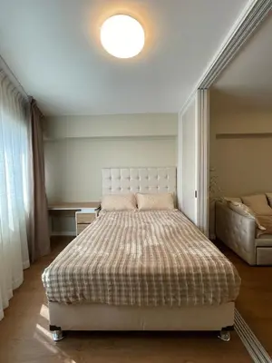 a bedroom with a large bed in a room at Mini Apartment Ares 2 in Lima