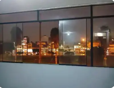 a view of a city skyline from a window at Departamento minimalista in Lima