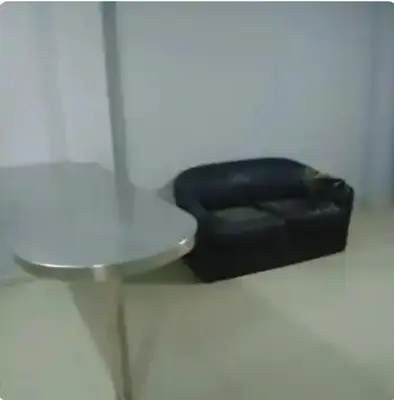 a black stool in a bathroom next to a toilet at Departamento minimalista in Lima