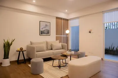 a living room with a couch and a table at Seaside Apartment near Malecon Miraflores by Wynwood House in Lima
