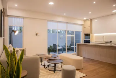 a kitchen and living room with a couch and a table at Seaside Apartment near Malecon Miraflores by Wynwood House in Lima