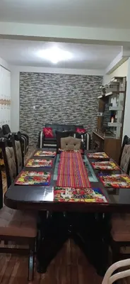 a long table with chairs in a room at Habitación triple in Huayllabamba