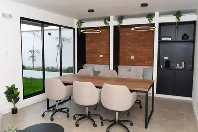a dining room with a table and chairs at Patria Inca Inn in Lima