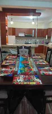 a table with a bunch of ties on it at Habitación simple triple in Huayllabamba