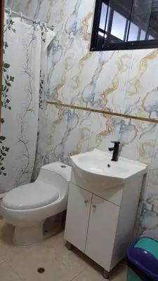 a bathroom with a toilet and a sink at Hospedaje el señorial in Lima