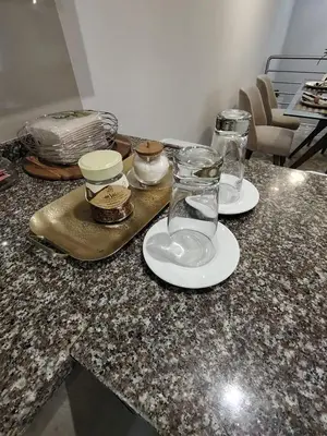 a counter with two glasses and a tray on it at GOLD DÚPLEX único c PISCINA PRIVADA MIRAFLORES P República 5655 in Lima