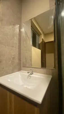 a bathroom with a white sink and a mirror at Céntrico Dpto Puca Lima a 2 cuadras de Hospital Rebagliati y Real Plaza Salaverry in Lima