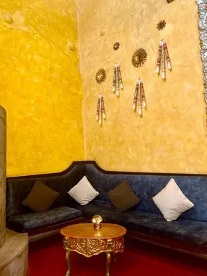 a living room with a couch and a table at Ayni Boutique Hotel in Cusco