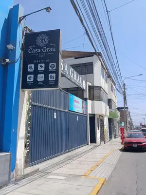 a sign on the side of a building on a street at Casa Grau Chincha in Chincha