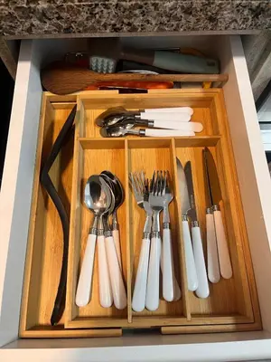 a wooden drawer with utensils in it at Departamento Salaverry in Lima