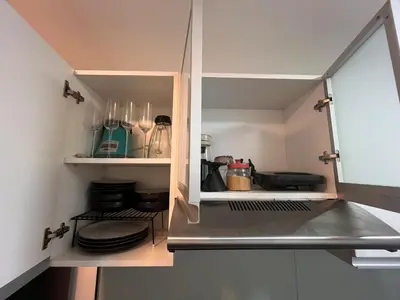 a kitchen with a counter top with some dishes at Departamento Salaverry in Lima