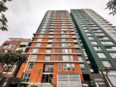 a tall apartment building with red brick at Departamento Salaverry in Lima