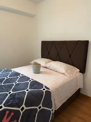 a bedroom with a bed with a bowl on it at TyB apartment in Lima