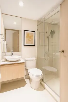 a bathroom with a toilet and a sink and a shower at Mario Vera Chavez in La Molina