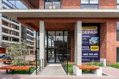 a store front with benches in front of a building at Solar Breezy Retreat by Geko in Lima