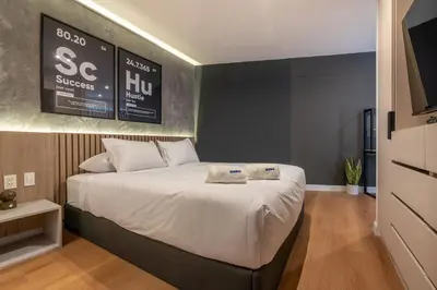 a bedroom with a bed with two towels on it at Solar Breezy Retreat by Geko in Lima