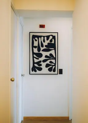 a hallway with a framed picture on the wall at Luxurious Apartment in the heart of Miraflores in Lima