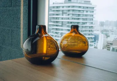 two vases sitting on a table in a window at Luxurious Apartment in the heart of Miraflores in Lima